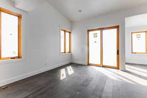 Unfurnished bedroom featuring wood finished floors