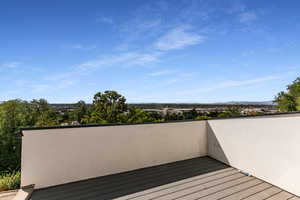 Wooden terrace featuring a mountain view