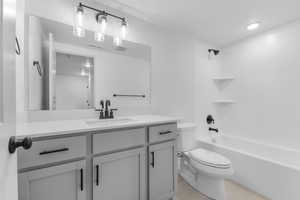 Full bathroom with vanity, tub / shower combination, and light tile patterned floors