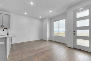 Unfurnished living room featuring recessed lighting and light wood-type flooring