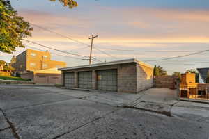 View of property at dusk