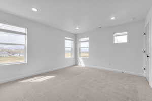 Unfurnished room with carpet and recessed lighting