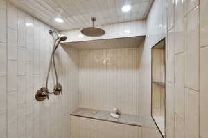 Bathroom featuring tiled shower and recessed lighting