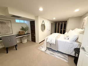 Carpeted bedroom with baseboards and recessed lighting