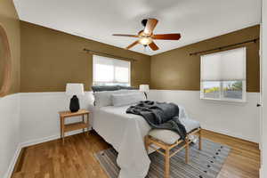 Bedroom featuring light wood-style flooring and a ceiling fan