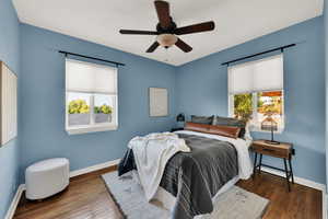 Bedroom featuring wood finished floors and a ceiling fan