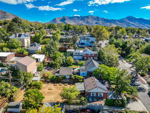 Aerial view of residential area featuring a mountain backdrop