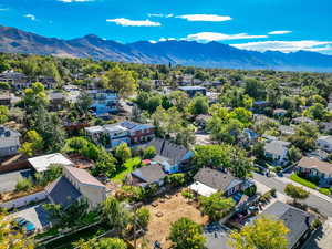 Aerial view of residential area featuring a mountainous background