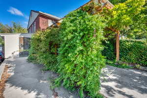 View of side of home featuring brick siding