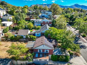 Aerial perspective of suburban area featuring a mountainous background
