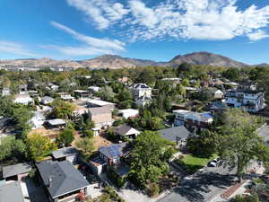 Aerial view of property's location featuring nearby suburban area and a mountain backdrop