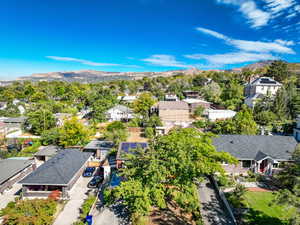 Aerial perspective of suburban area with a mountainous background