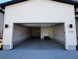 Garage with concrete driveway