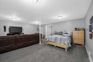 Carpeted bedroom with baseboards