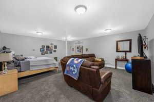 Carpeted bedroom with baseboards