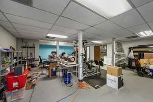 Finished basement with a paneled ceiling