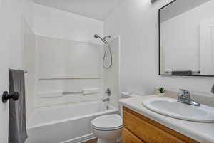 Bathroom featuring shower / bathtub combination and vanity