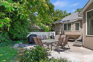 View of patio featuring outdoor dining area and area for grilling