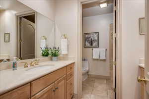 Bathroom with vanity and light tile patterned floors