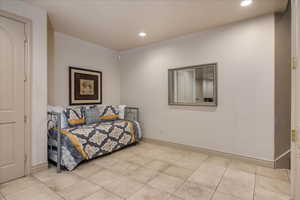 Bedroom with recessed lighting and light tile patterned floors