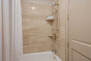 Full bath featuring shower / bath combo