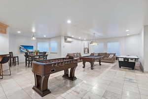 Game room featuring billiards table, recessed lighting, and light tile patterned floors