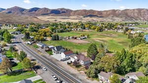 View of property location featuring a mountainous background and nearby suburban area