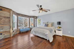 Bedroom featuring dark wood-style flooring and ceiling fan