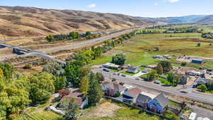 Aerial view of residential area featuring a mountainous background