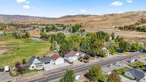 Aerial perspective of suburban area featuring a mountainous background