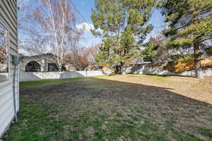 View of fenced backyard