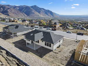 Aerial view of residential area featuring a mountainous background