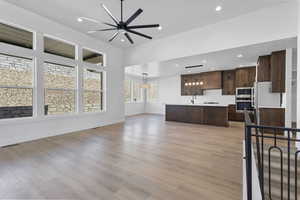 Unfurnished living room featuring recessed lighting, light wood-type flooring, and ceiling fan