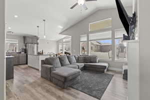 Great Room with large windows and vaulted ceilings.