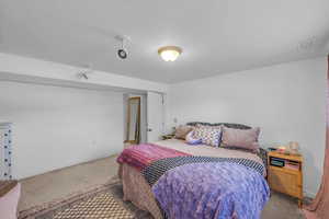 Carpeted bedroom with baseboards