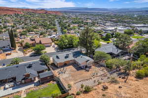 Aerial perspective of suburban area with a mountainous background