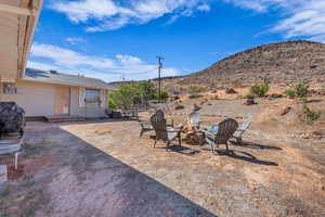 View of yard with a patio and a fire pit