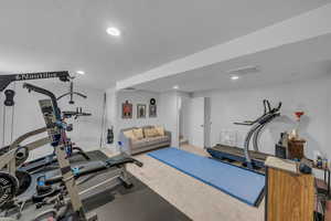 Exercise area with recessed lighting and carpet flooring