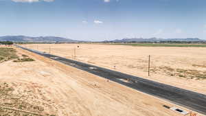 View of yard featuring a mountain view and a view of countryside