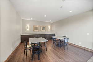 Common area with dark wood-style floors and recessed lighting
