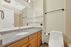 Full bathroom featuring vanity and toilet