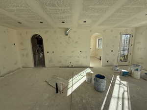 Empty room featuring arched walkways