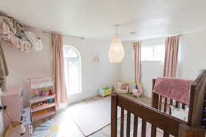 Bedroom with light wood-style floors