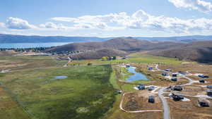 View of property location featuring a water and mountain view and rural landscape