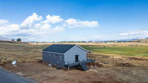 View of outdoor structure featuring a view of countryside and a mountain view