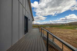 Deck featuring a mountain view and a rural view
