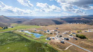 View of property location featuring rural landscape and a water and mountain view