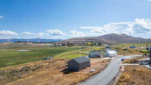 View of mountain background featuring rural landscape