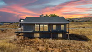 Back of property featuring roof with shingles and board and batten siding