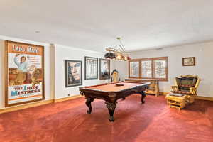 Game room featuring ornamental molding, pool table, and carpet
